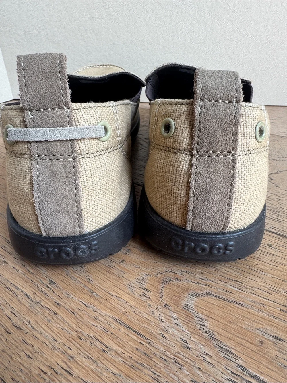 pair of khaki canvas Crocs Men's Walu Slip-On Loafers